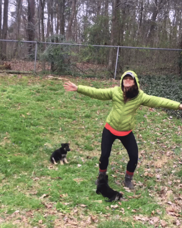 Woman being active during while social distancing with two puppies.